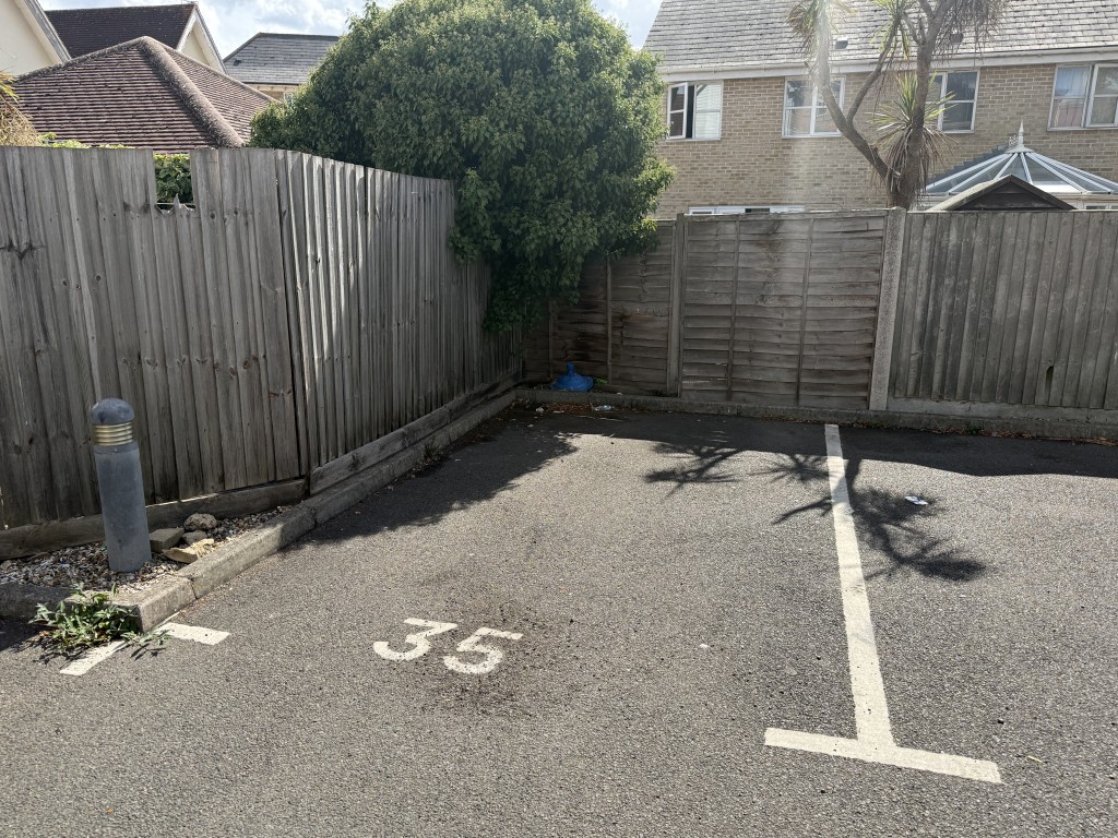 Lot: 36 - TWO-BEDROOM FIRST FLOOR FLAT FOR IMPROVEMENT - Shot of allocated and numbered as 35 parking space